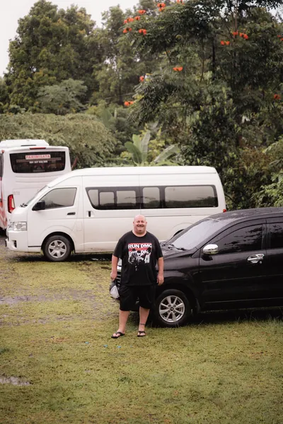 A guest next to the trip van